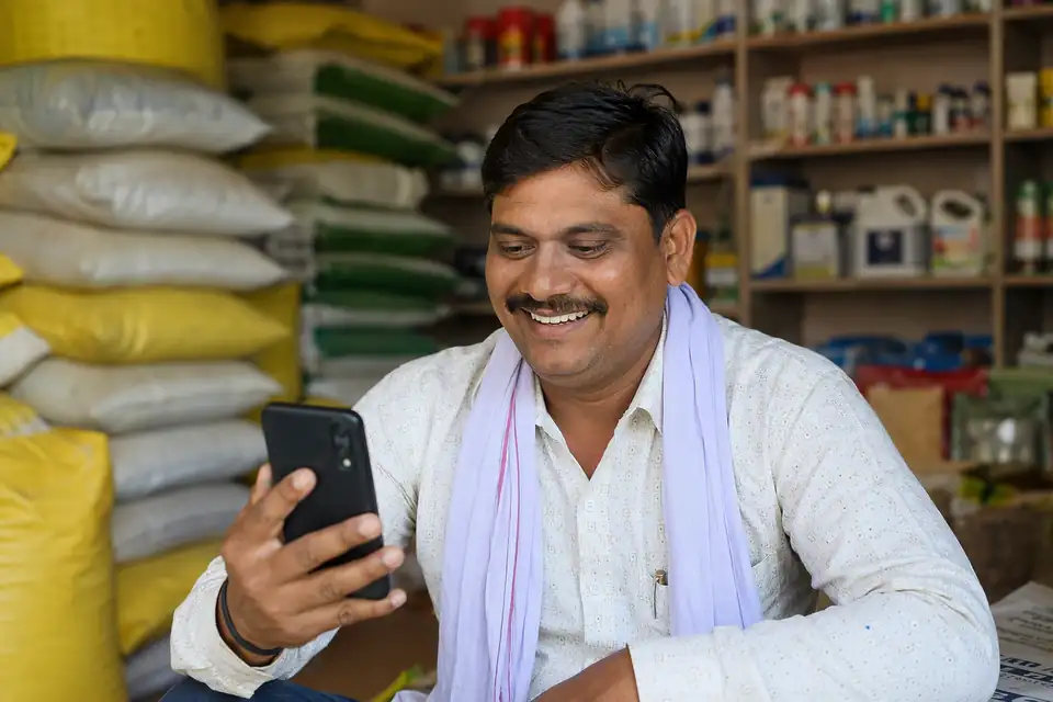 A happy Animal Feed & Veterinary channel partner seeing incentive progress on his phone with Unotag