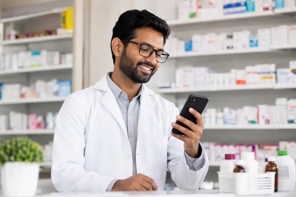 A happy Pharmaceuticals channel partner seeing incentive progress on his phone with Unotag